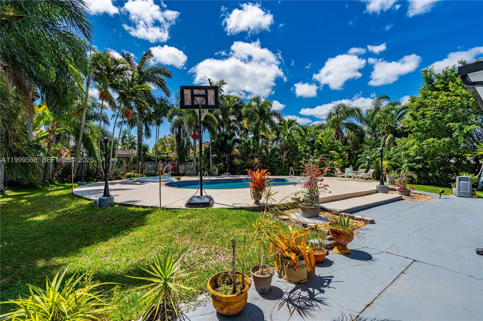 13790 Southwest 174th Street Miami, FL 33177 - Photo 37 of 41 a swimming pool with outdoor seating