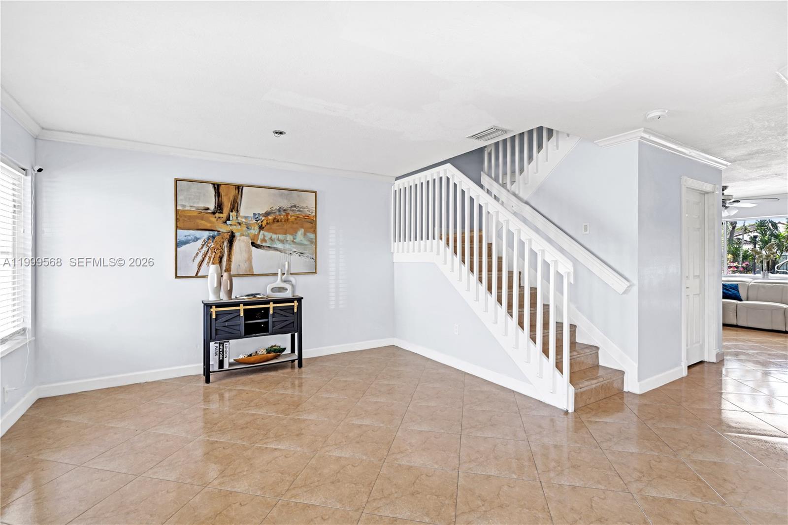 13790 Southwest 174th Street Miami, FL 33177 - Photo 9 of 41 a view of a hallway with wooden floor and furniture