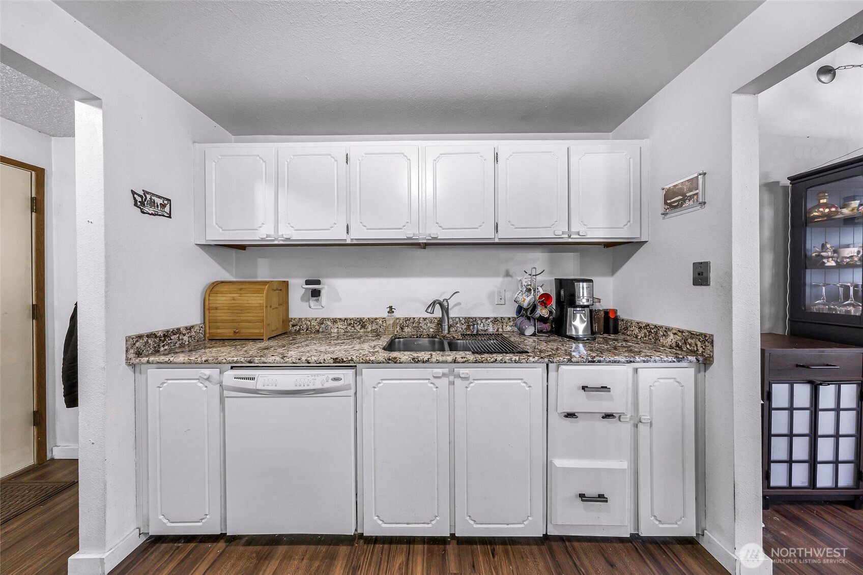 1730 Southwest 318th Place, Unit 39D Federal Way, WA 98023 - Photo 16 of 36 a kitchen with granite countertop a sink and cabinets