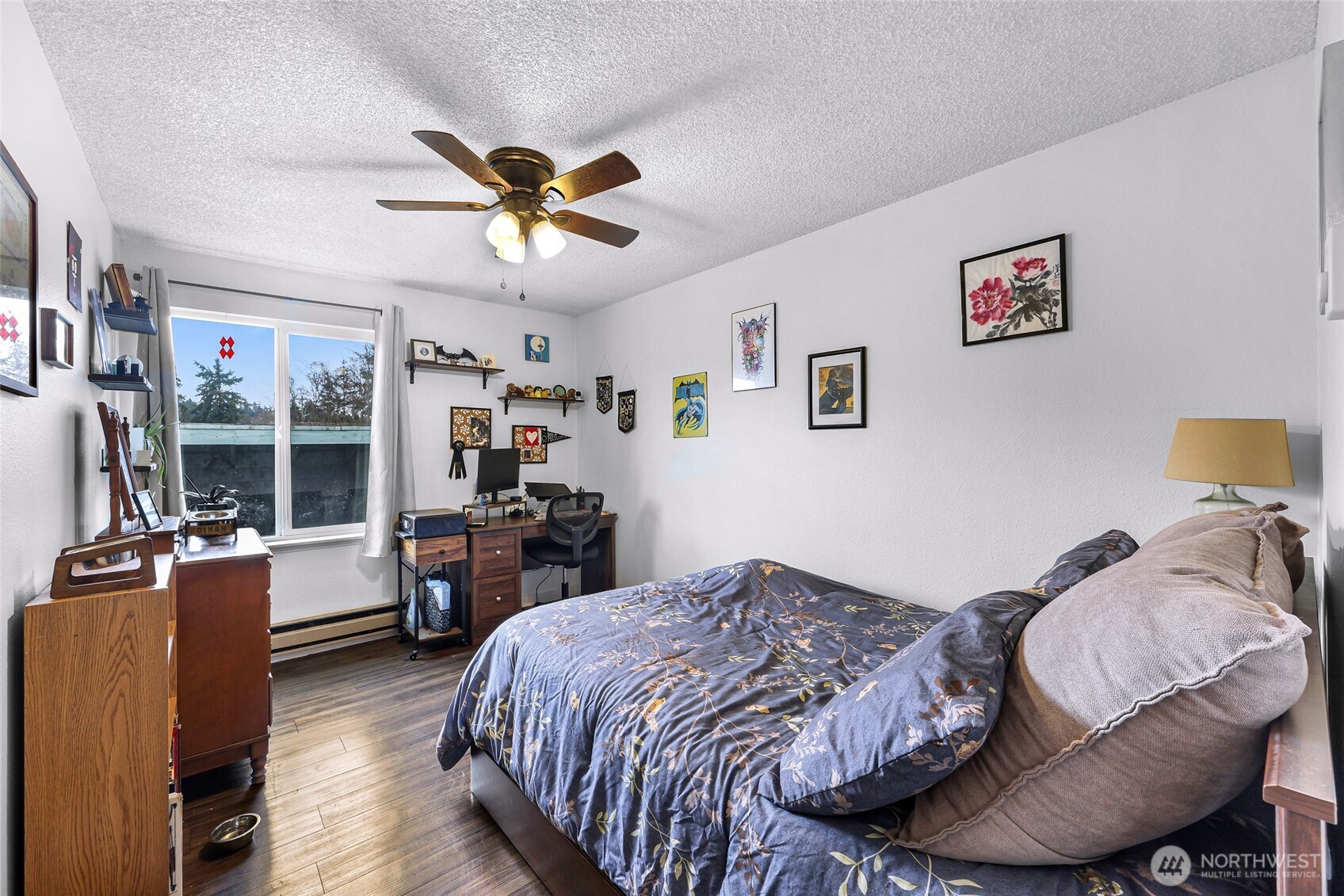 1730 Southwest 318th Place, Unit 39D Federal Way, WA 98023 - Photo 18 of 36 a bedroom with a bed and wooden floor