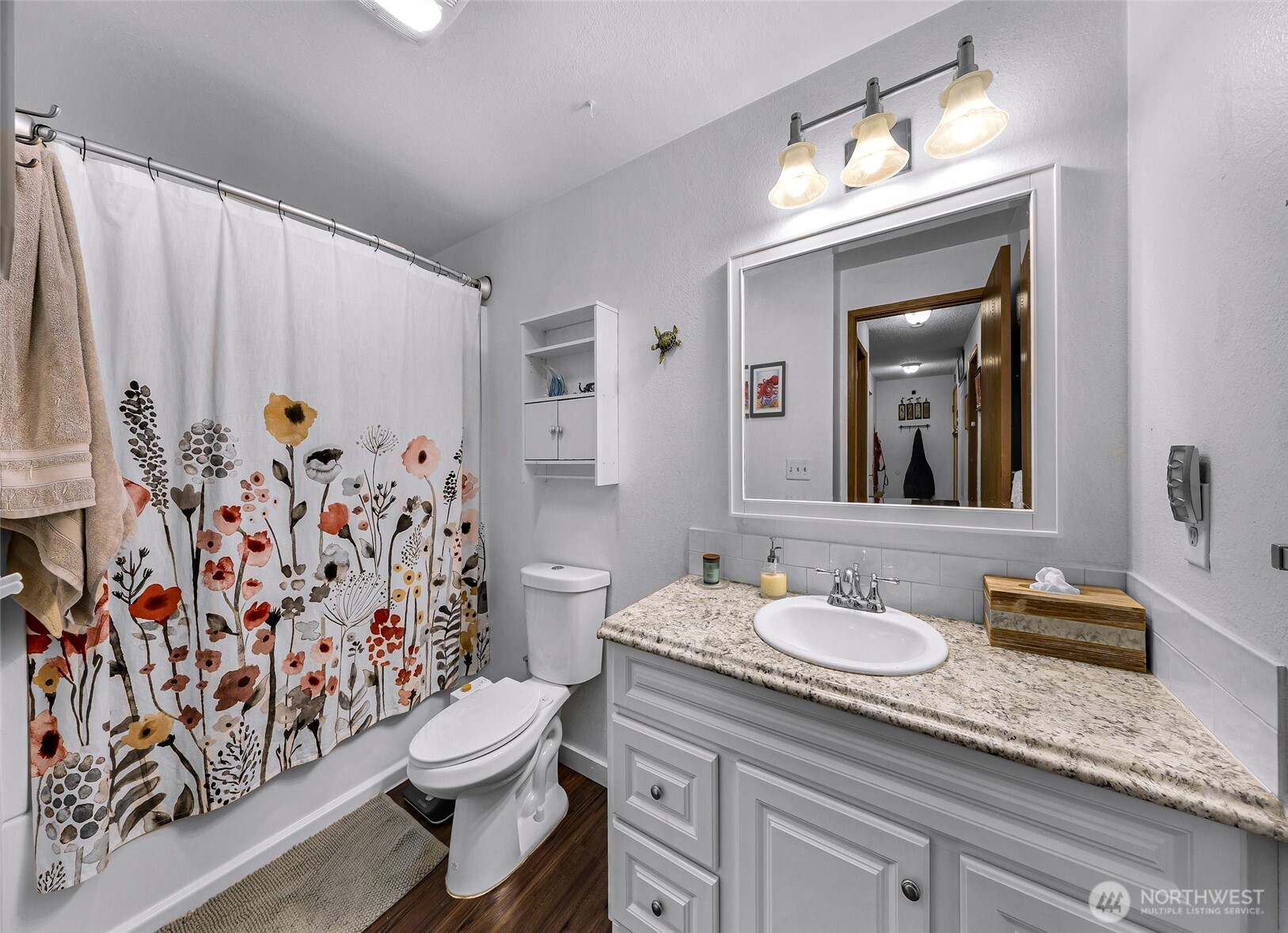1730 Southwest 318th Place, Unit 39D Federal Way, WA 98023 - Photo 21 of 36 a bathroom with a granite countertop sink a toilet and a mirror