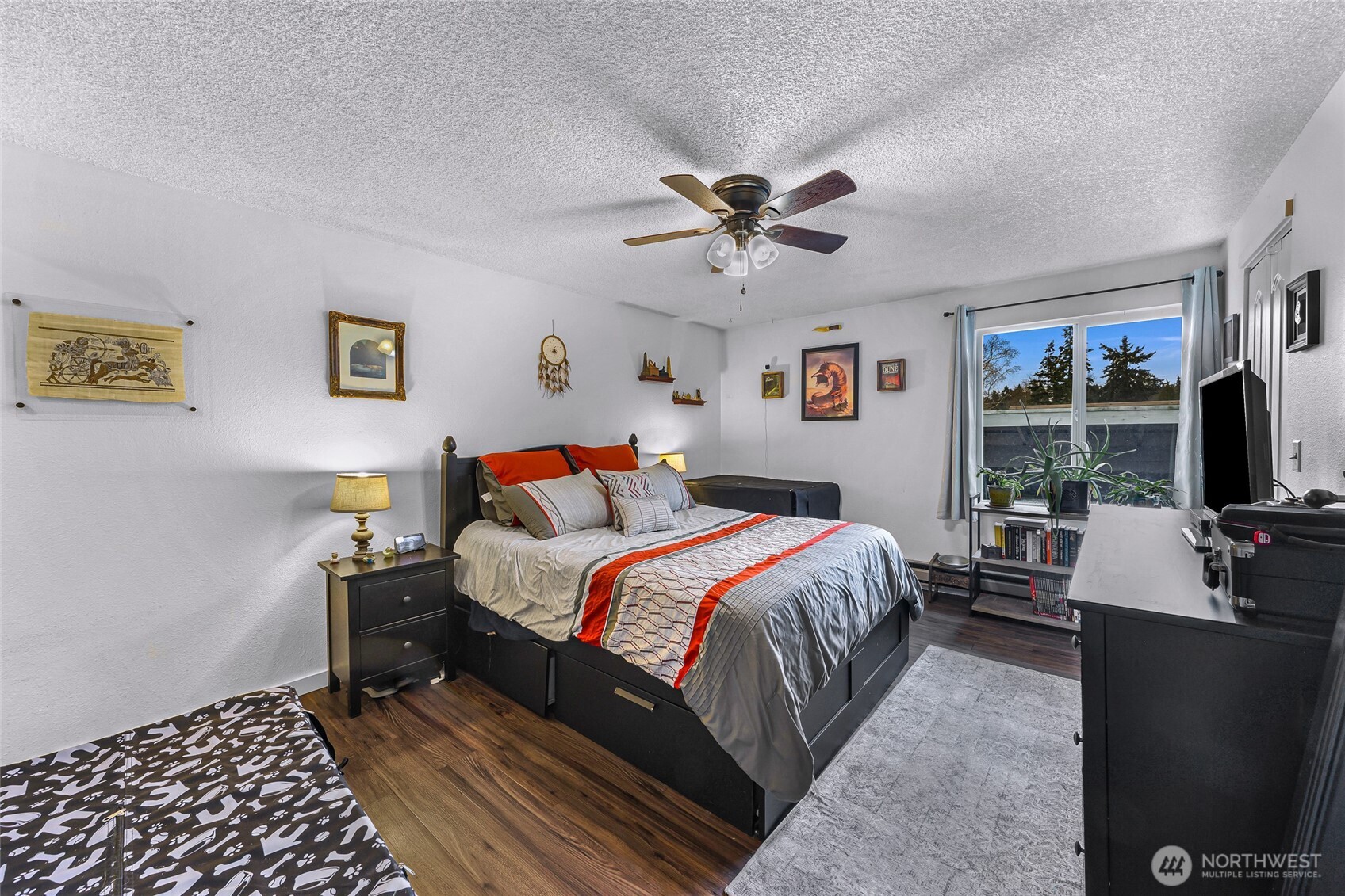 1730 Southwest 318th Place, Unit 39D Federal Way, WA 98023 - Photo 22 of 36 a bed room with a bed and a television