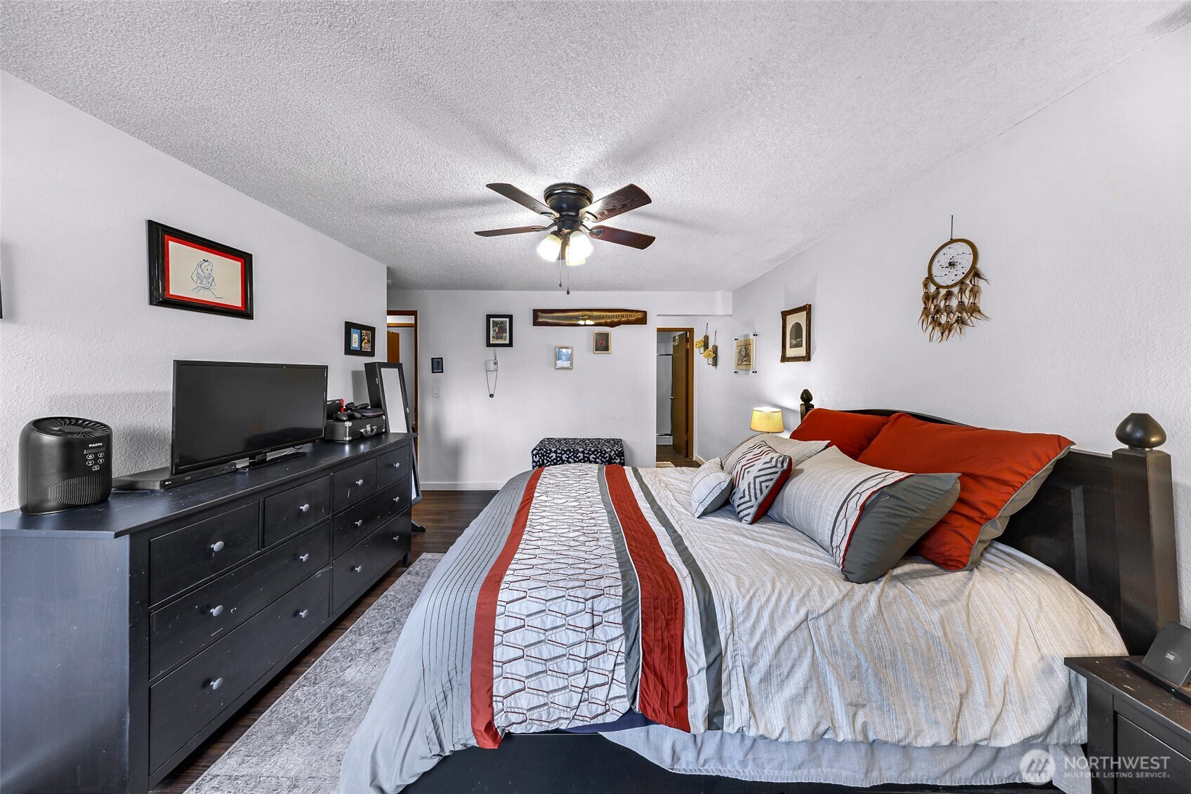 1730 Southwest 318th Place, Unit 39D Federal Way, WA 98023 - Photo 25 of 36 a bedroom with a bed and a flat screen tv
