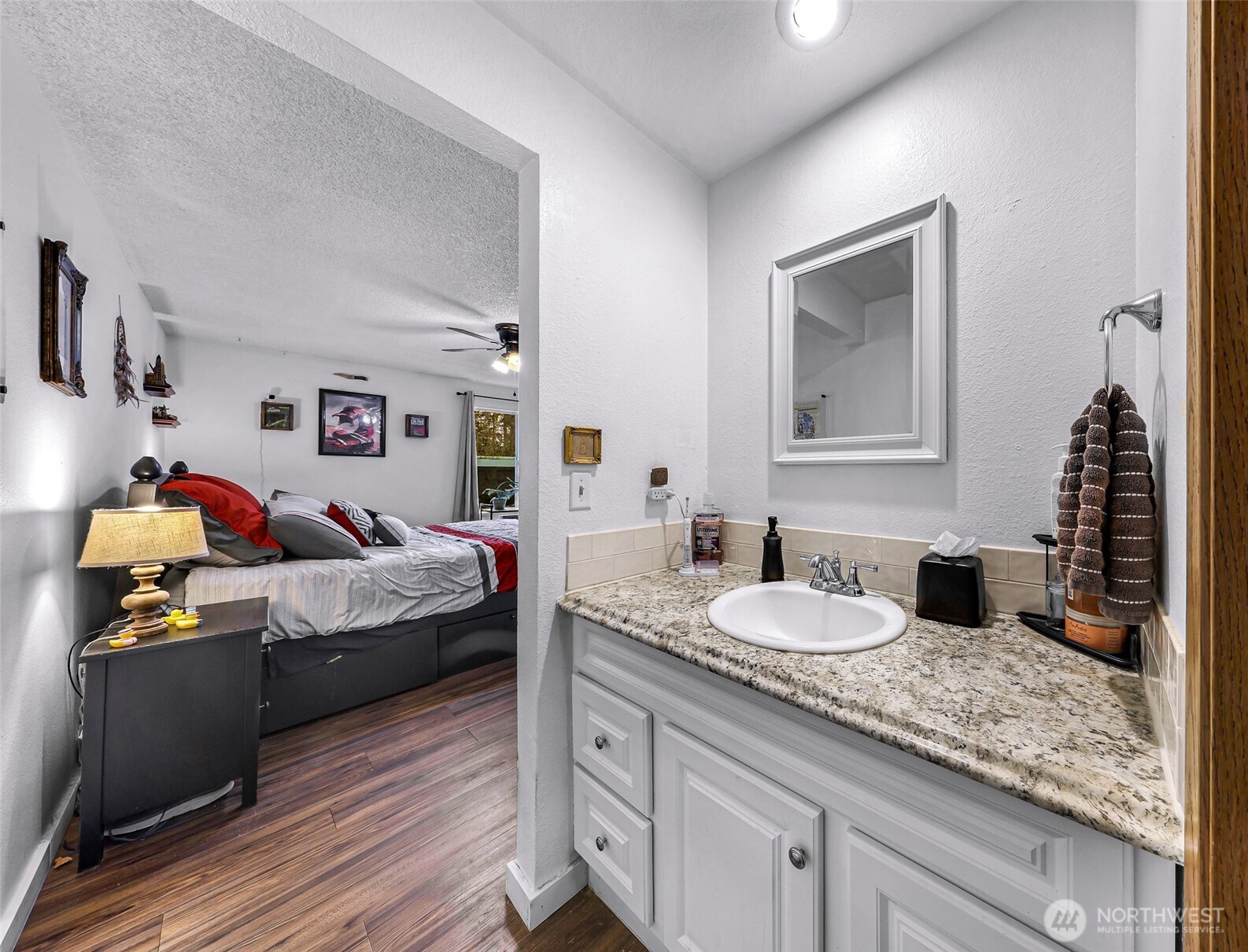 1730 Southwest 318th Place, Unit 39D Federal Way, WA 98023 - Photo 27 of 36 a bedroom with a bed and wooden floor
