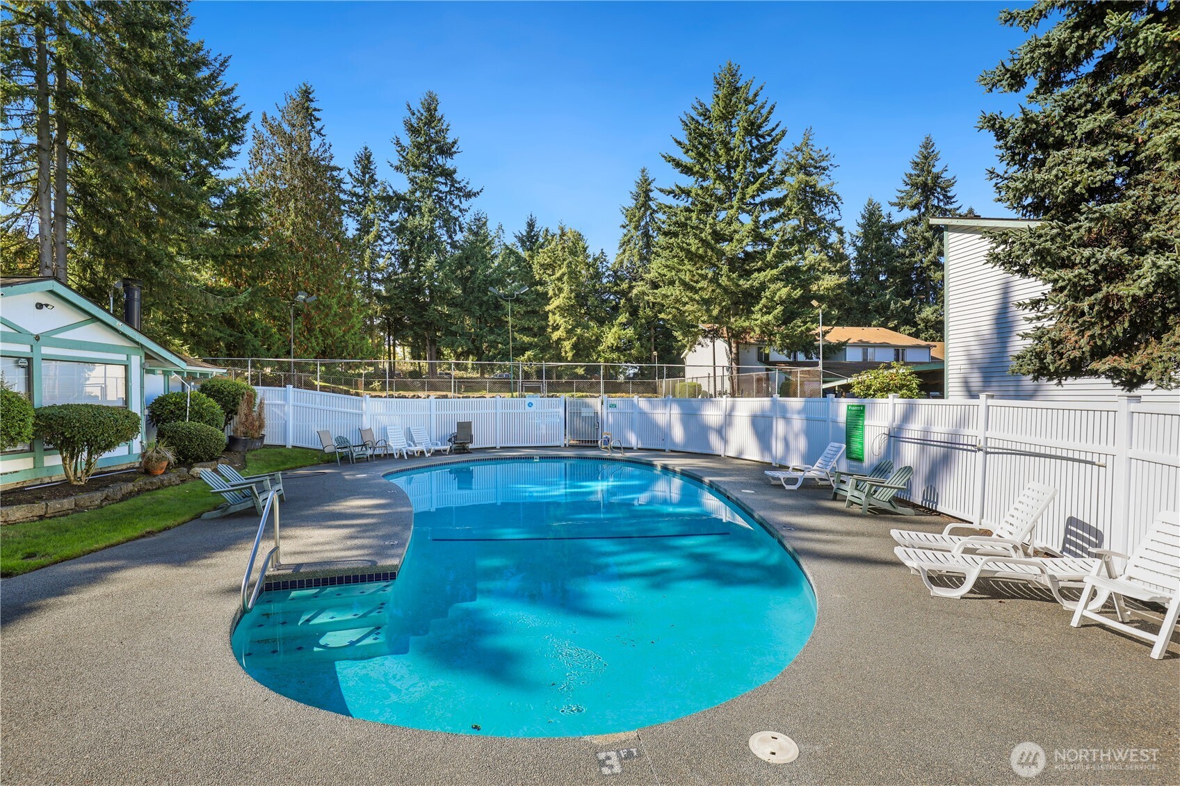 1730 Southwest 318th Place, Unit 39D Federal Way, WA 98023 - Photo 29 of 36 a view of a swimming pool with a patio