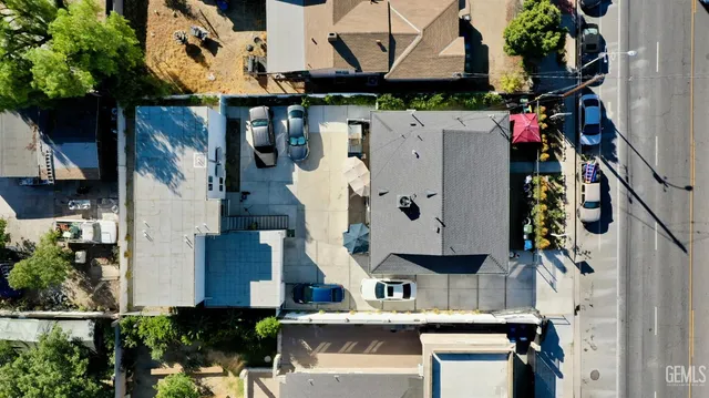 a view of building along with street and trees