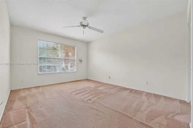 an aerial view of a house with yard