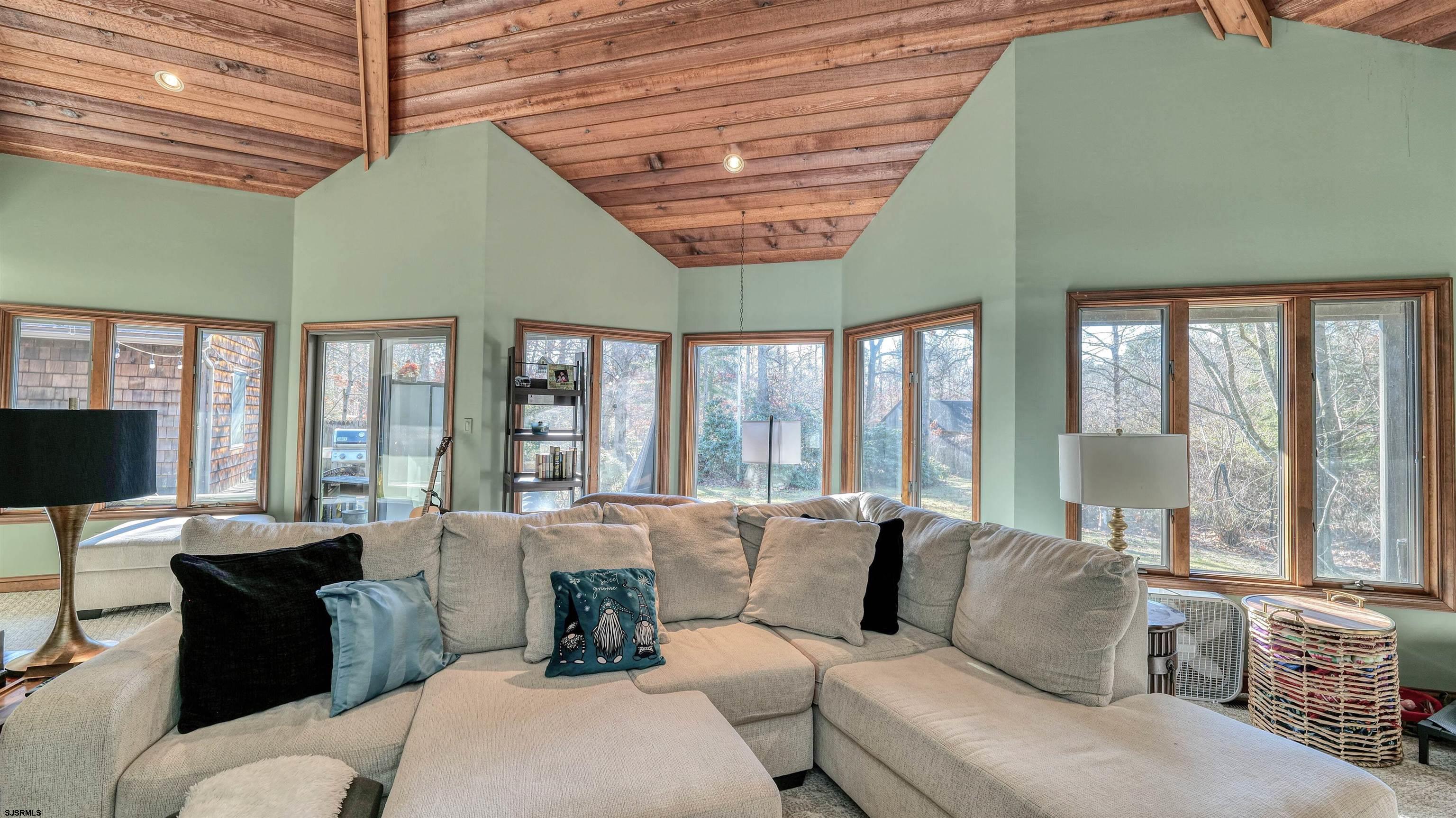 3 School House Road Egg Harbor Township, NJ 08234 - Photo 15 of 56 a living room with furniture and large windows