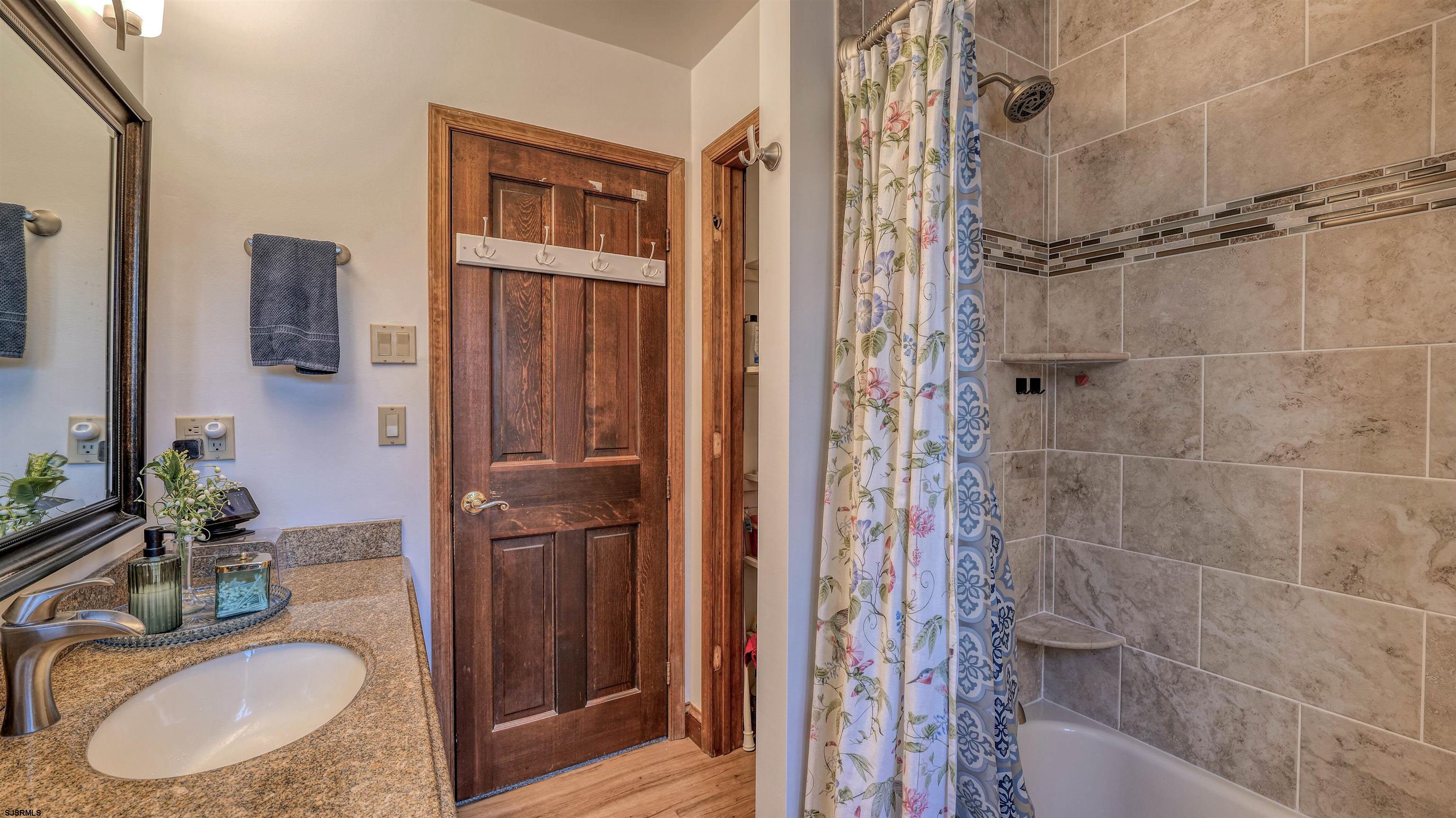 3 School House Road Egg Harbor Township, NJ 08234 - Photo 21 of 56 a bathroom with a granite countertop shower a sink and a mirror