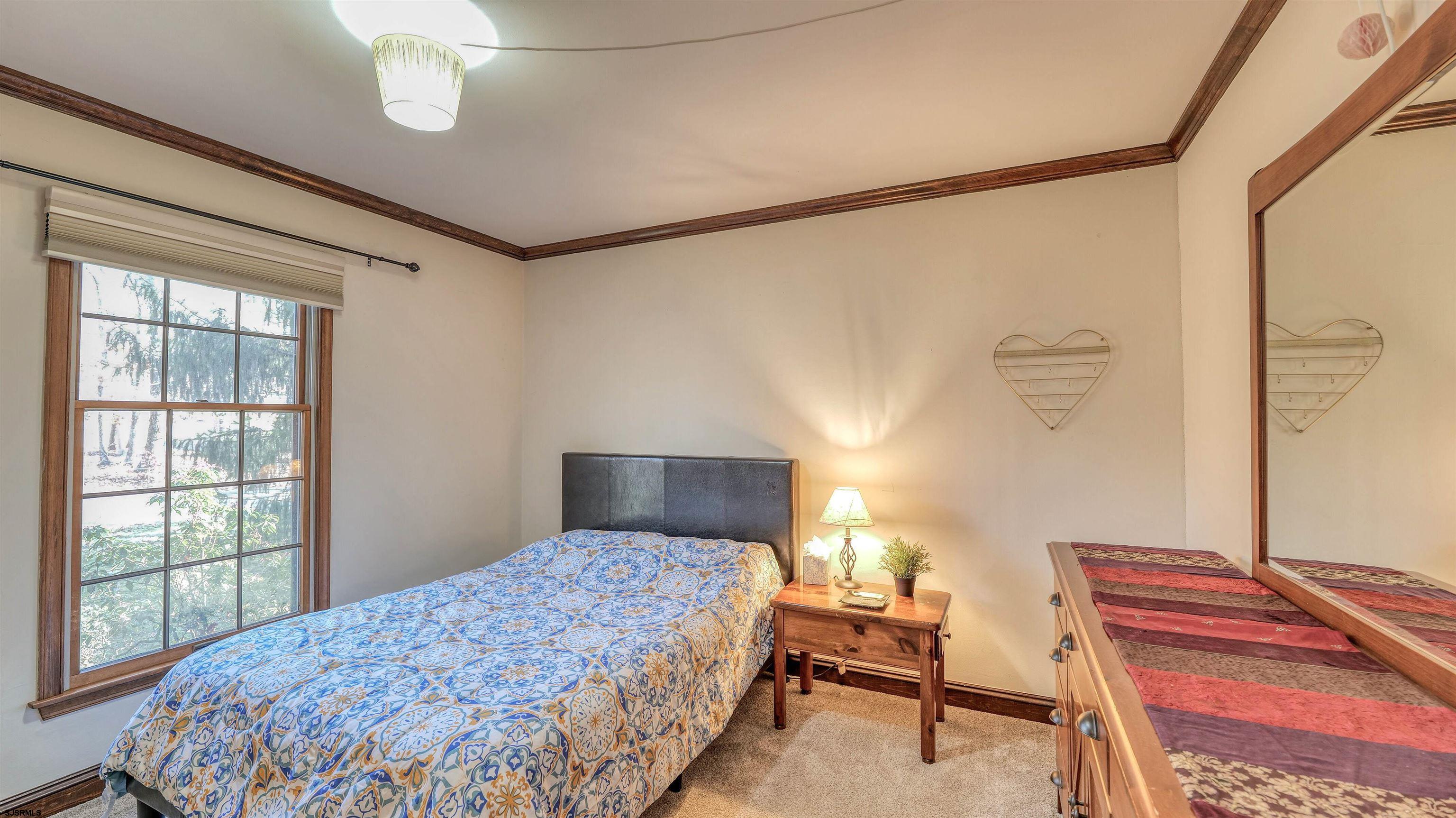 3 School House Road Egg Harbor Township, NJ 08234 - Photo 24 of 56 a bedroom with a bed and a window