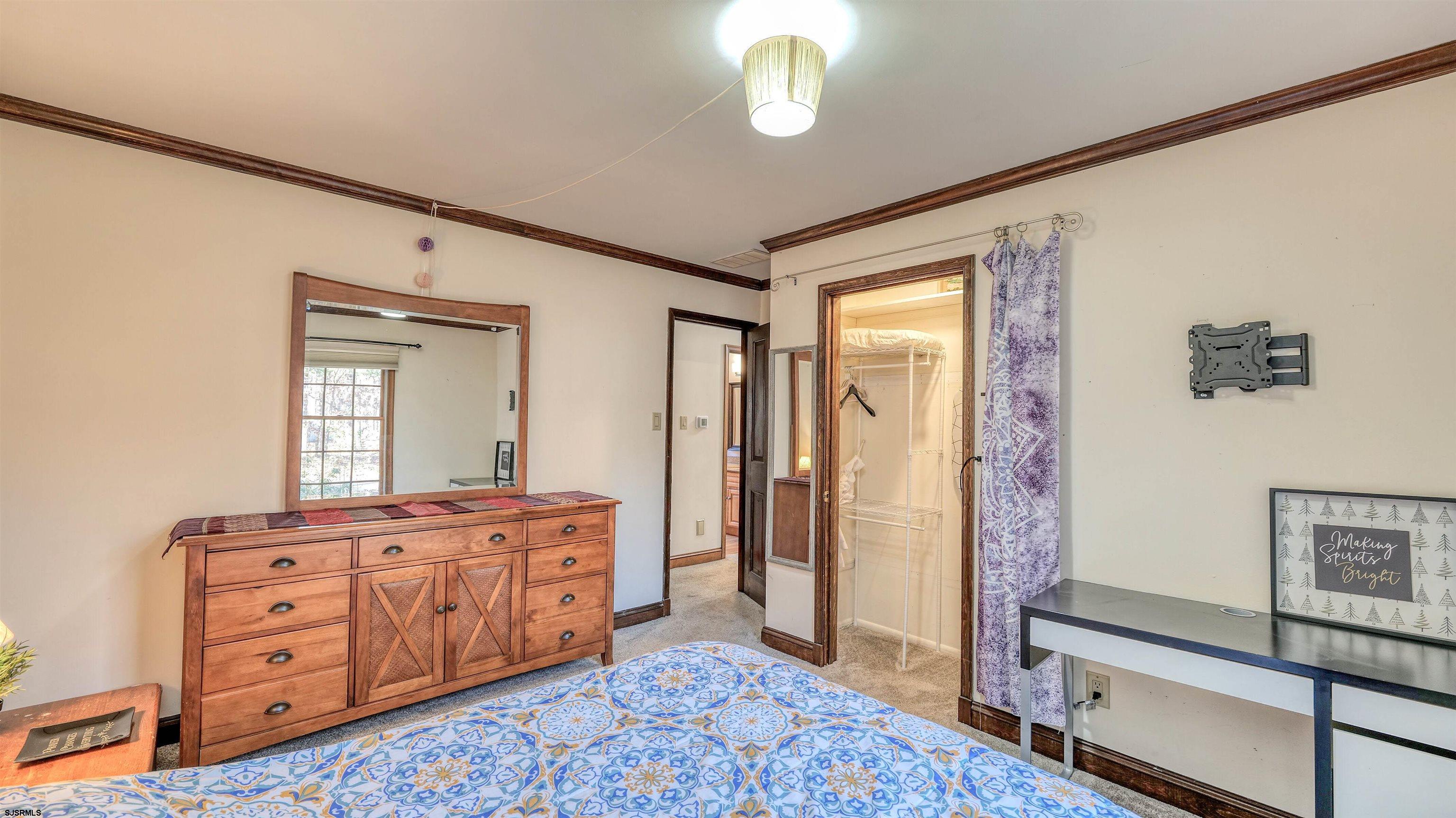 3 School House Road Egg Harbor Township, NJ 08234 - Photo 25 of 56 a room with dresser and window