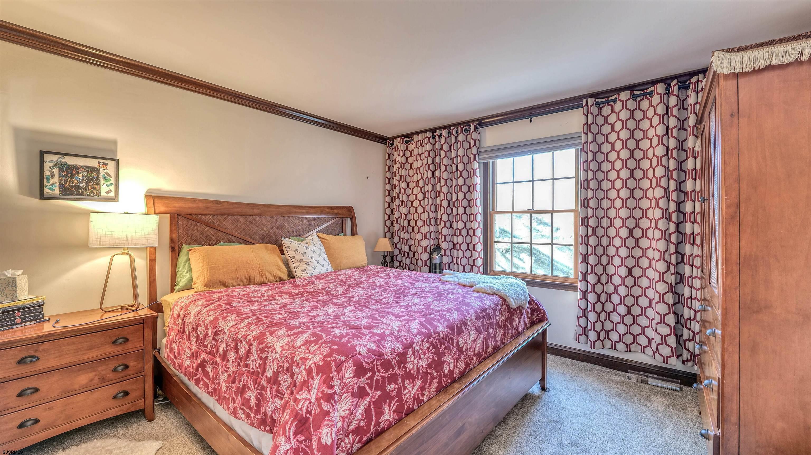 3 School House Road Egg Harbor Township, NJ 08234 - Photo 28 of 56 a bedroom with a bed and a window