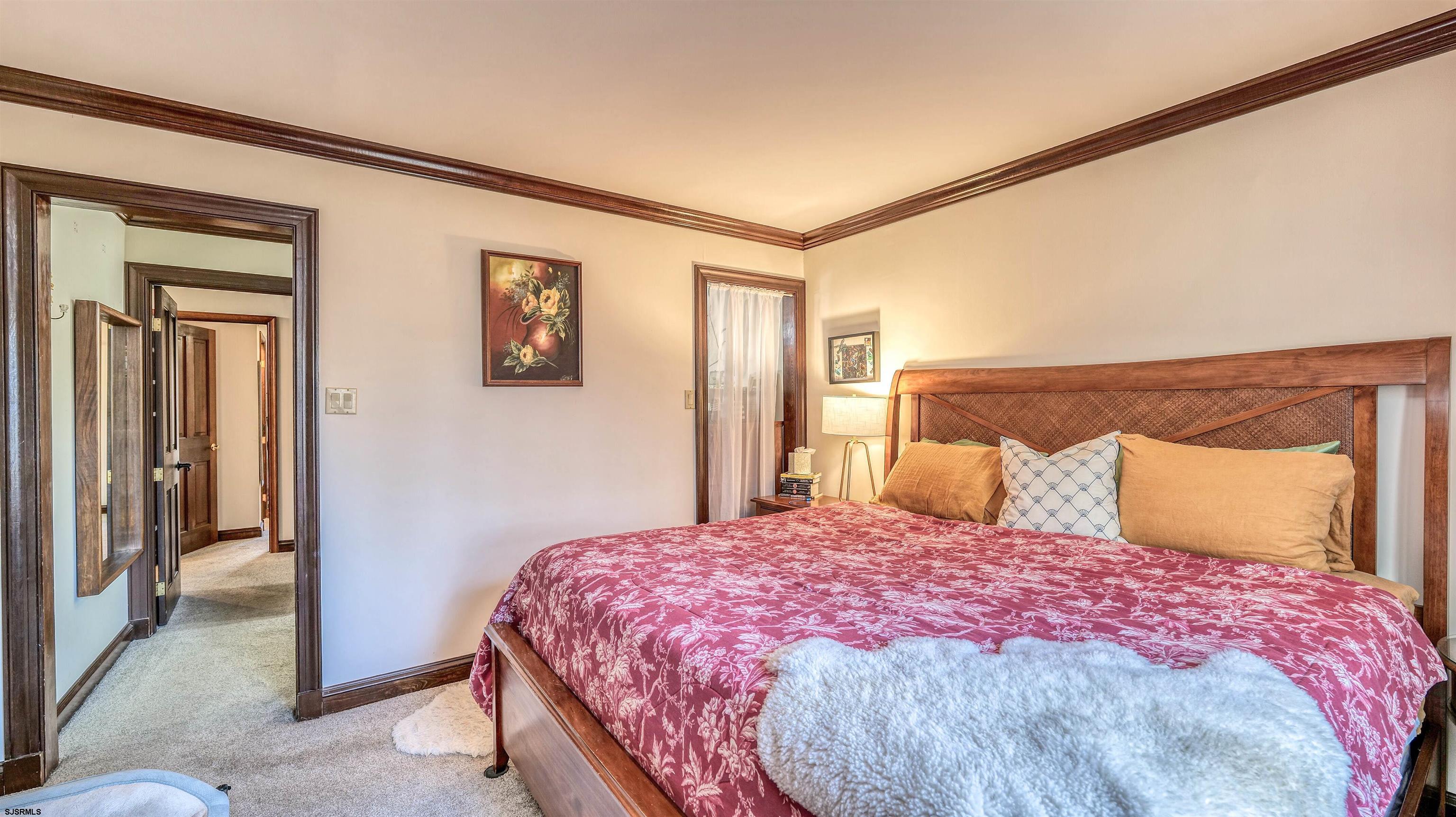 3 School House Road Egg Harbor Township, NJ 08234 - Photo 29 of 56 a bedroom with a bed and a painting on the wall