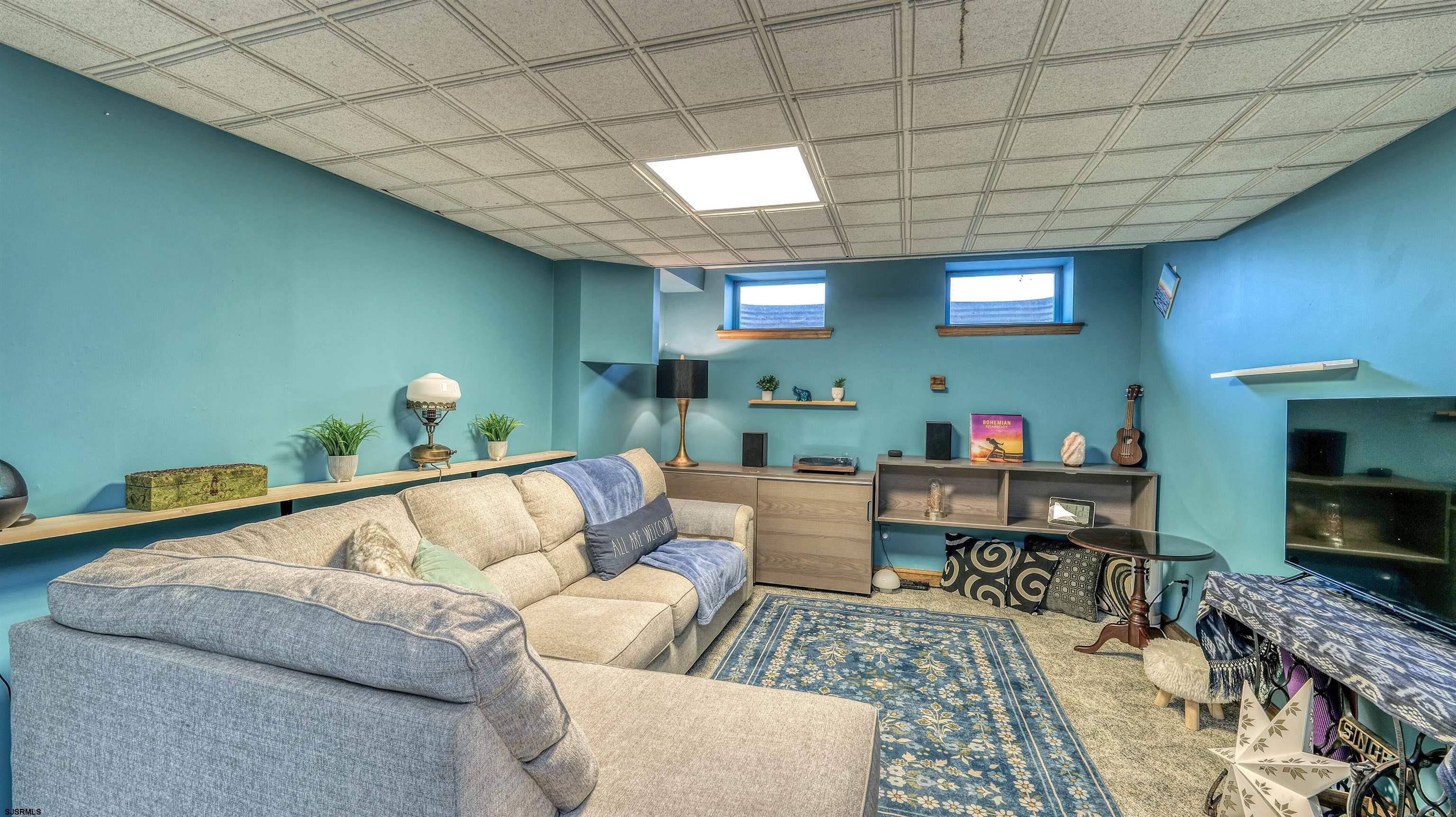 3 School House Road Egg Harbor Township, NJ 08234 - Photo 30 of 56 a living room with furniture and a flat screen tv