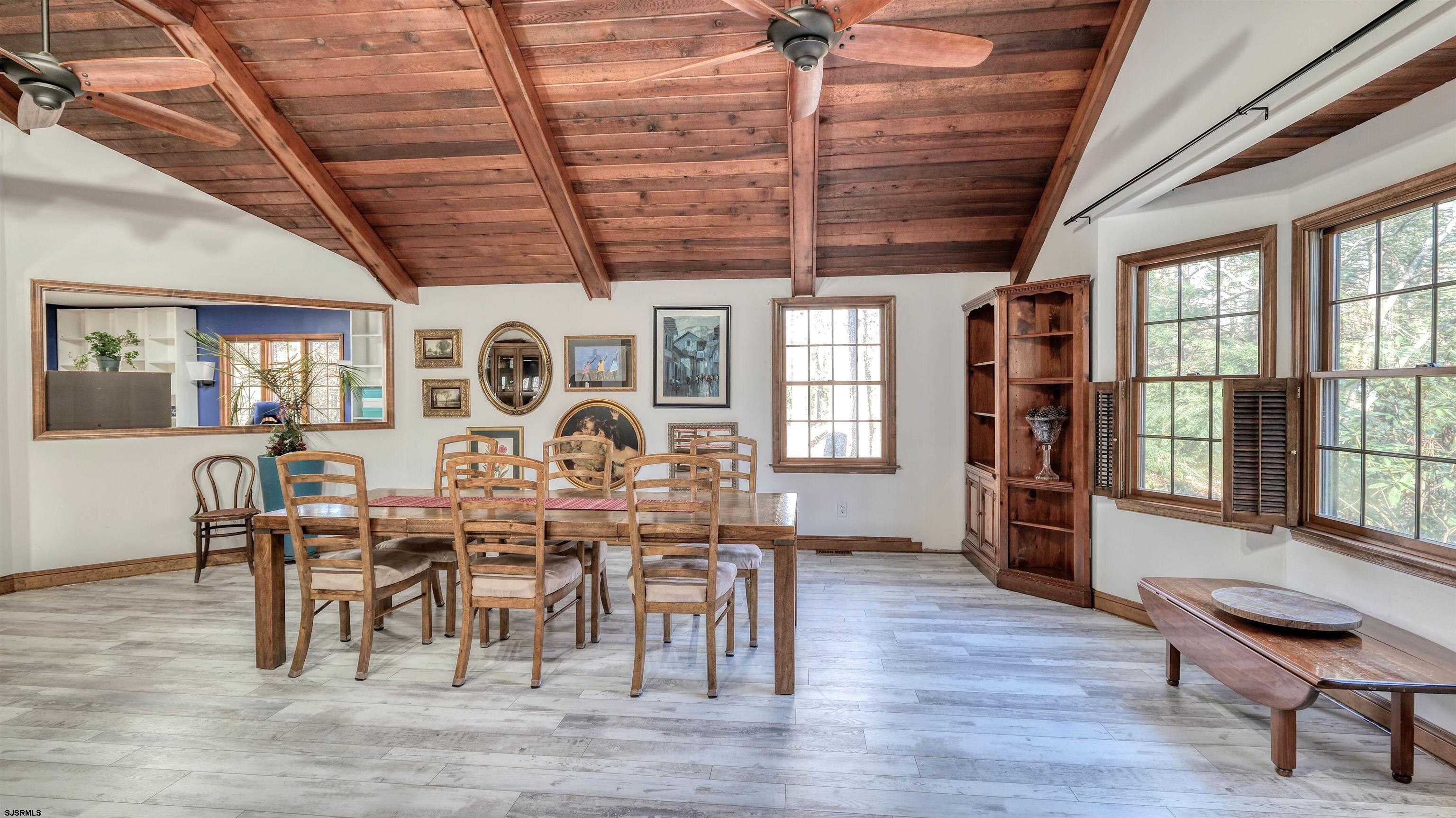 3 School House Road Egg Harbor Township, NJ 08234 - Photo 3 of 56 a view of a dining room with furniture window and wooden floor