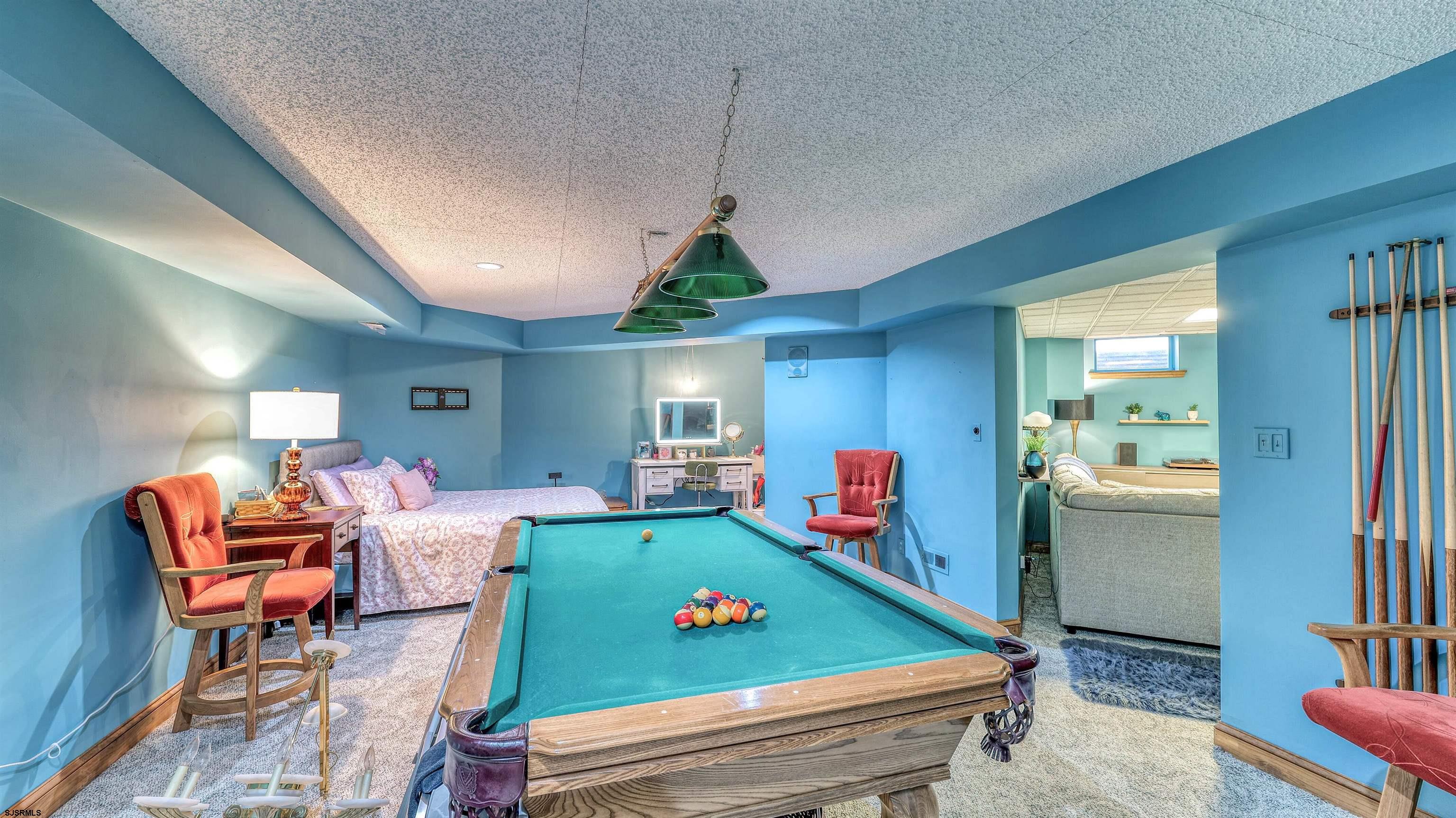 3 School House Road Egg Harbor Township, NJ 08234 - Photo 32 of 56 a living room with furniture a flat screen tv and kitchen view