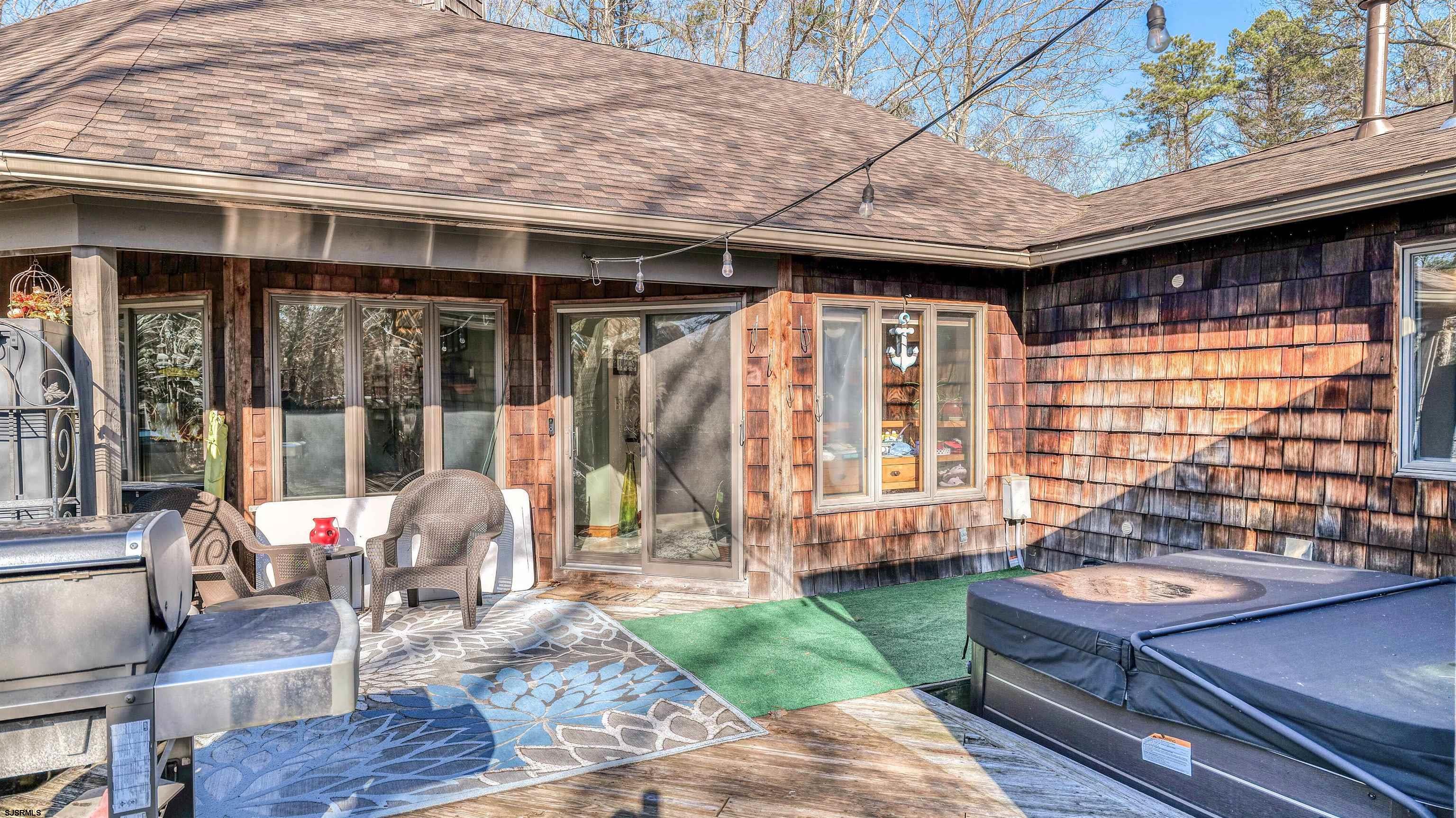 3 School House Road Egg Harbor Township, NJ 08234 - Photo 35 of 56 a backyard of a house with outdoor seating