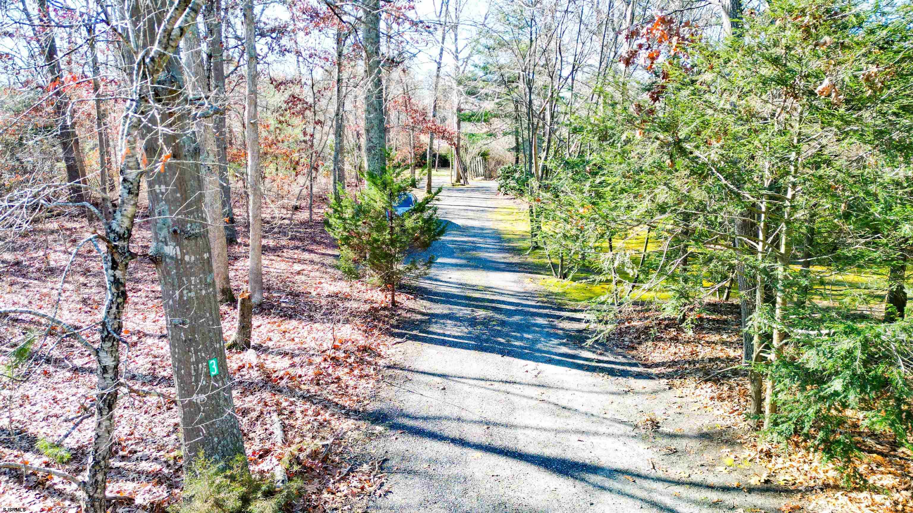 3 School House Road Egg Harbor Township, NJ 08234 - Photo 47 of 56 a front view of a house with a yard and flowers