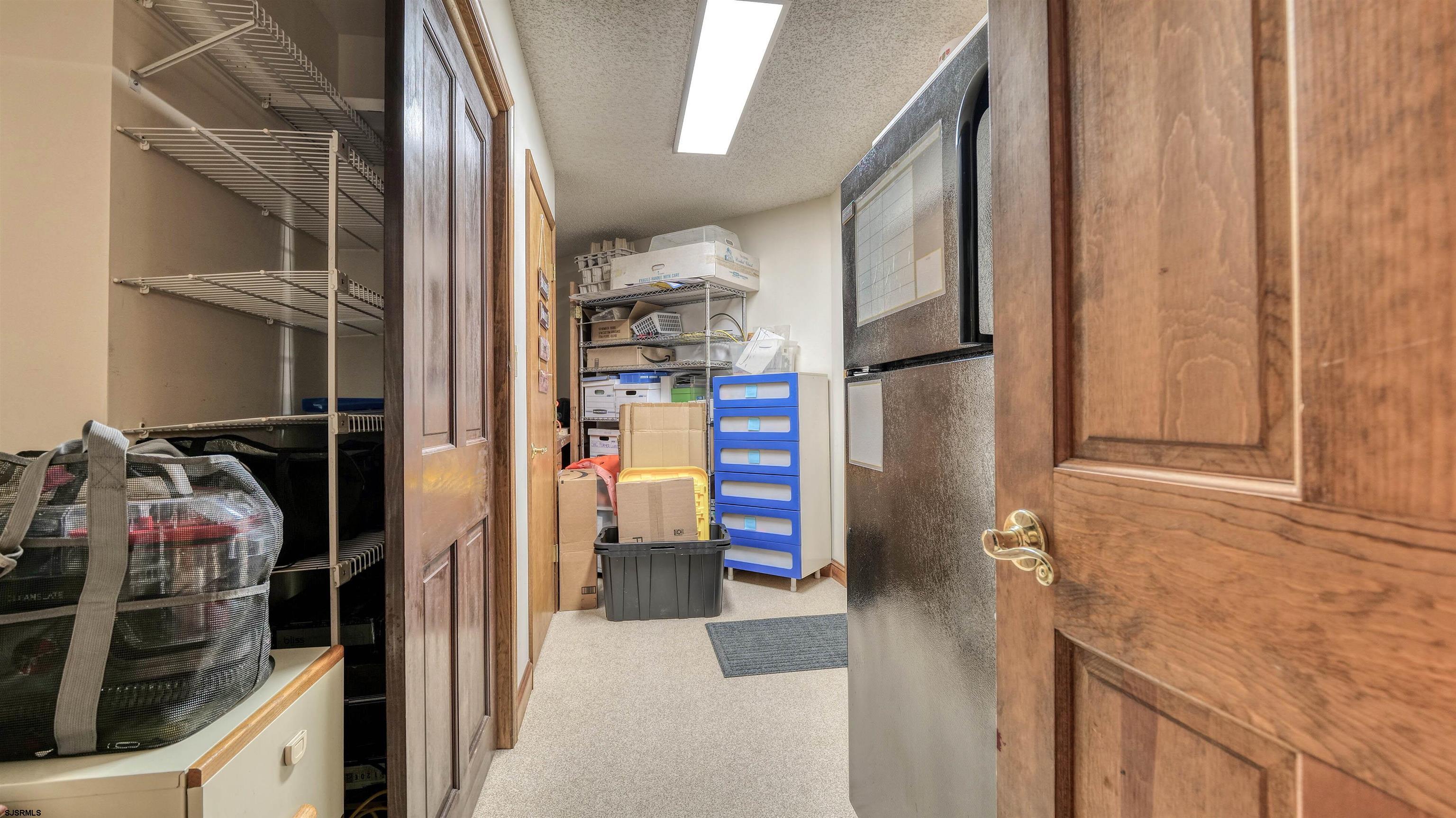 3 School House Road Egg Harbor Township, NJ 08234 - Photo 9 of 56 a view of walk in closet with clothes and shoes