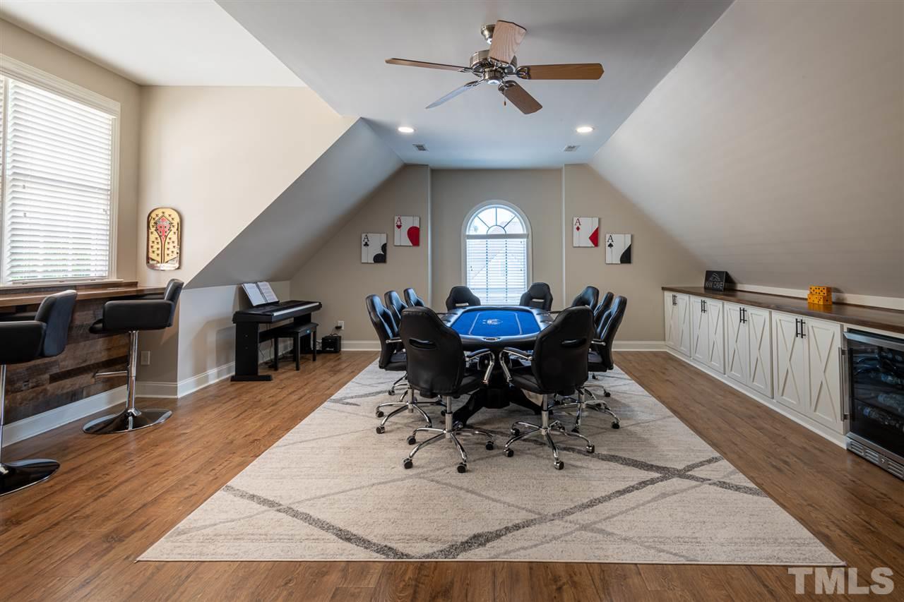 2916 SnapsWell Street Raleigh, NC 27614 - Photo 19 of 30 This Game Room offers Beautiful and Easy Clean Up Flooring, Custom Built Cabinetry with Wood Counter Top and Stunning Bar Top. Plenty of Space for Hobbies, Crafts, Games, Toys and Furniture. Make it Your Own !
