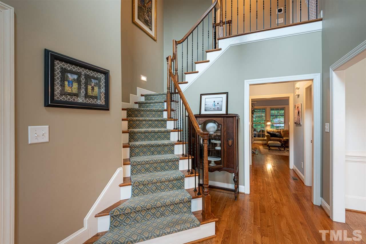 2916 SnapsWell Street Raleigh, NC 27614 - Photo 3 of 30 Greet Your Guests in this Beautiful Two Story Open Foyer. Impressive Side Angled Staircase with Attractive Runner PLUS Gorgeous Hardwood Flooring.