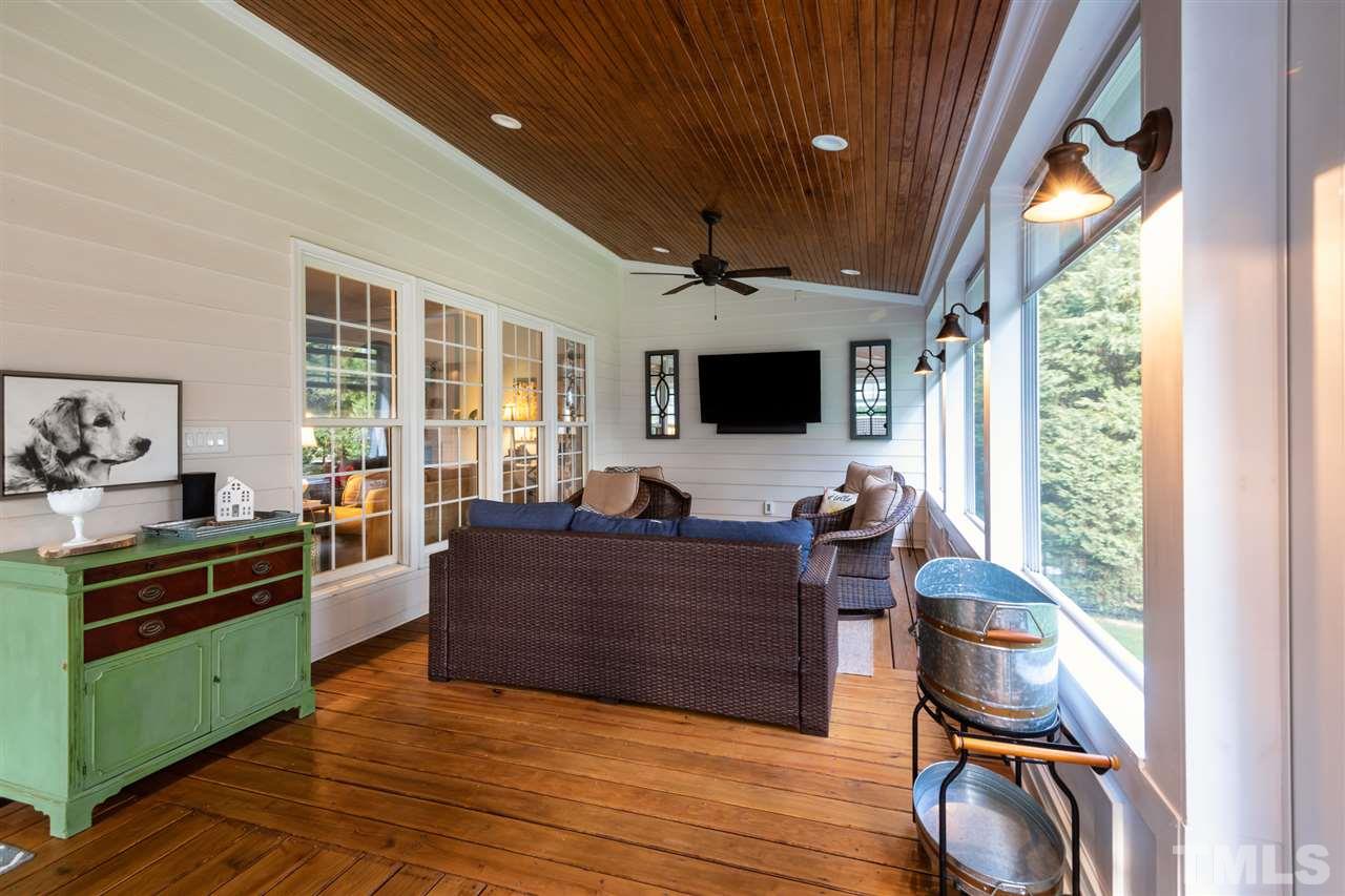 2916 SnapsWell Street Raleigh, NC 27614 - Photo 29 of 30 Take the Party to the Three Season Room ! Ceiling fan, Cable Hook Up and Comfortable Temperature to Entertain and Watch a Game. Complete with EZ Breeze Windows !
