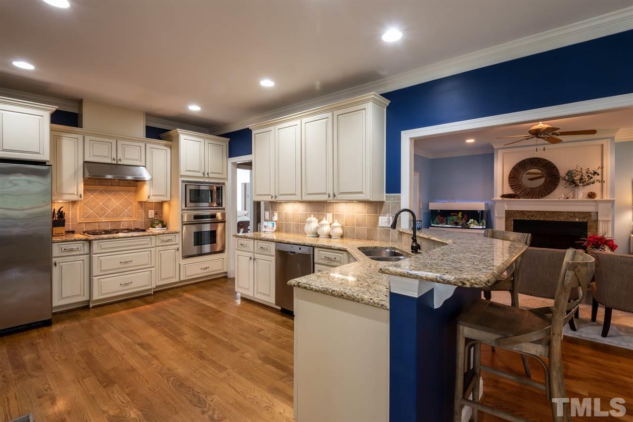 2916 SnapsWell Street Raleigh, NC 27614 - Photo 6 of 30 Spacious Kitchen Allows Lots of "Cooks in this Kitchen"! Complete with Can Lights, High End Appliances and Tons of Cabinet Space.