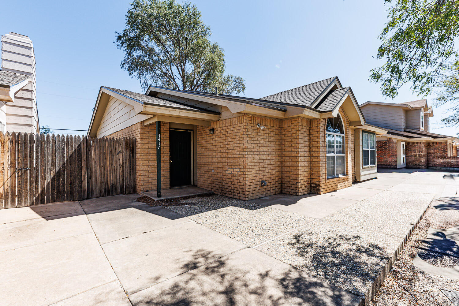 Package Property Package Property 6th Street Lubbock, TX 79416 - Photo 14 of 14 a view of house with backyard and trees in the background