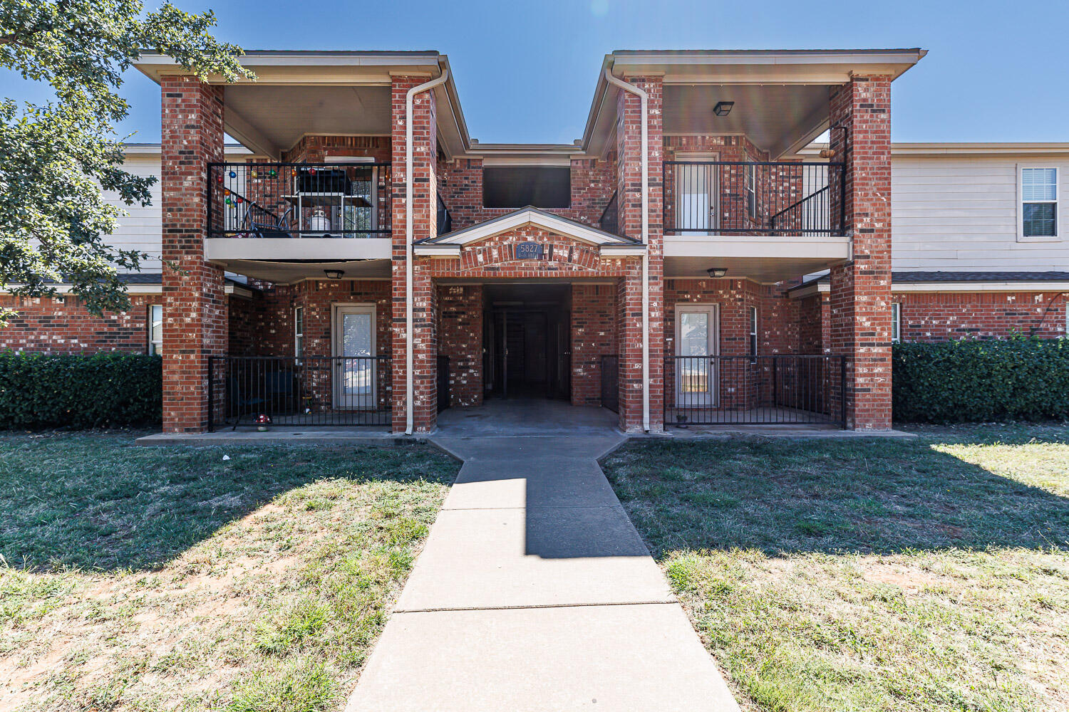 Package Property Package Property 6th Street Lubbock, TX 79416 - Photo 2 of 14 a view of a building with a yard and large tree