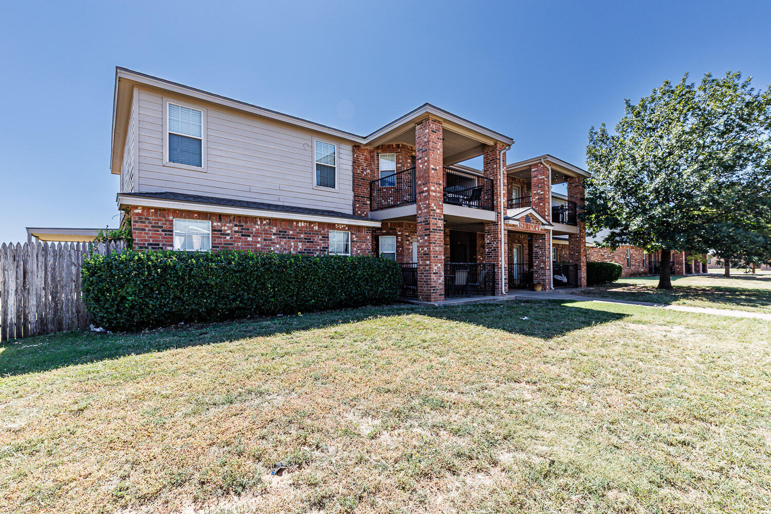 Package Property Package Property 6th Street Lubbock, TX 79416 - Photo 6 of 14 a front view of a house with a yard