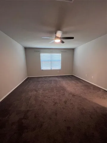 a view of empty room with windows