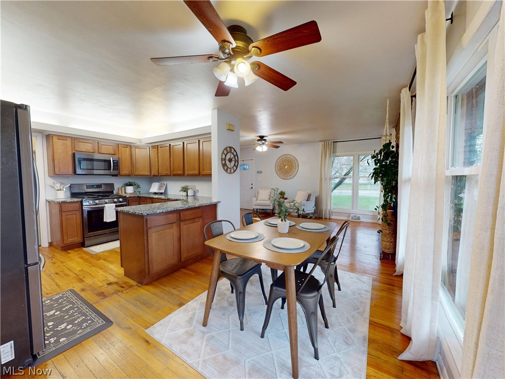 162 South Leavitt Road Amherst, OH 44001 - Photo 7 of 41 Dining room featuring light wood finished floors and a ceiling fan