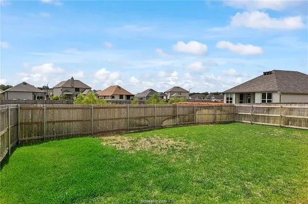 a view of front of house with a yard