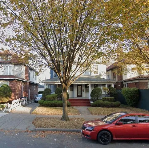 a front view of a house with parking space