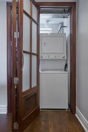 a utility room with closet dryer and washer