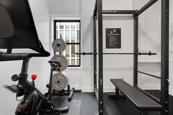 a room with gym equipment and a window