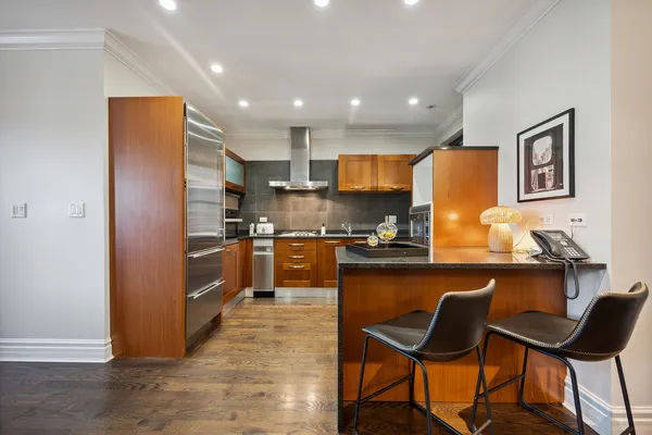 a kitchen with granite countertop counter space a sink appliances and cabinets