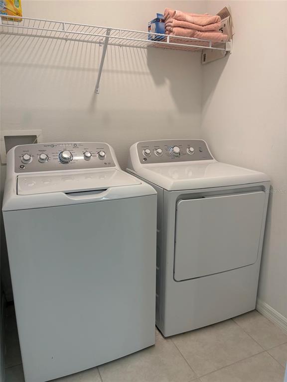14442 Editors Note Street Ruskin, FL 33573 - Photo 13 of 31 a utility room with dryer and washer