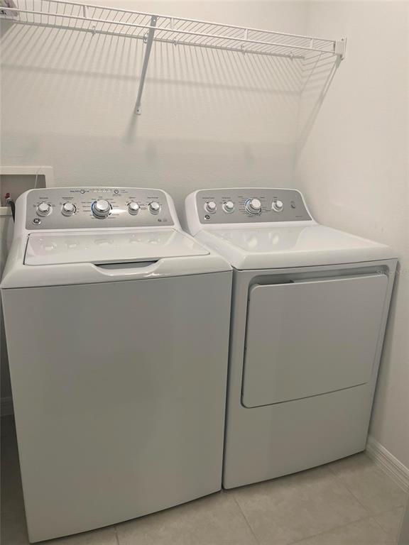 14442 Editors Note Street Ruskin, FL 33573 - Photo 14 of 31 a utility room with dryer and washer