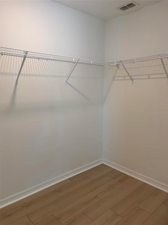 14442 Editors Note Street Ruskin, FL 33573 - Photo 17 of 31 a view of a room with racks on the wall