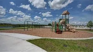 a view of a park with large trees