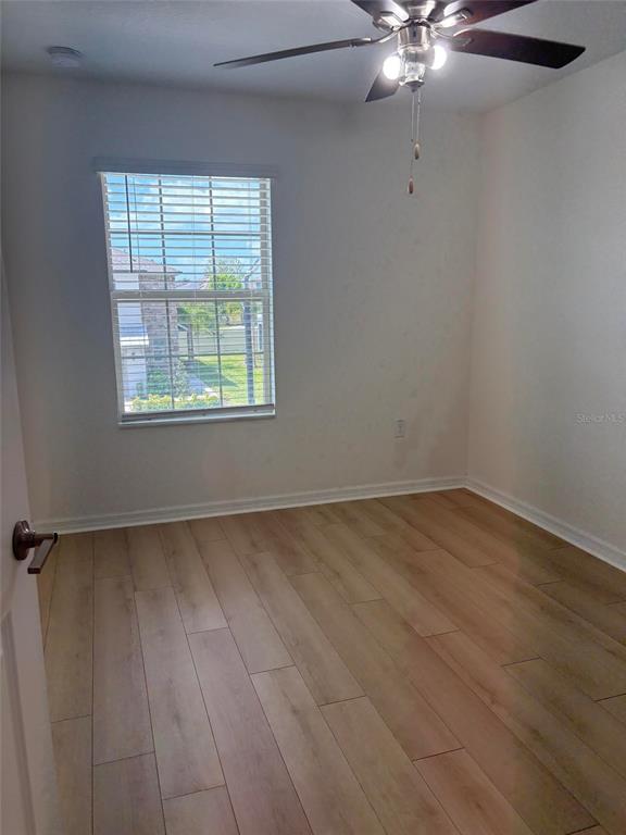 14442 Editors Note Street Ruskin, FL 33573 - Photo 7 of 31 an empty room with a window