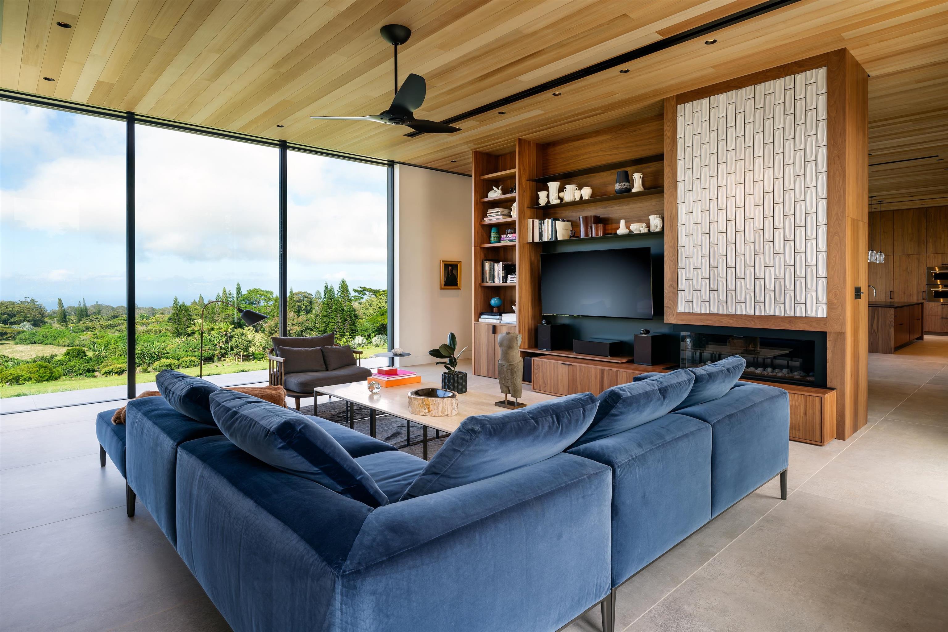 1642 West Kuiaha Road Haiku, HI 96708 - Photo 11 of 50 a living room with furniture and a flat screen tv