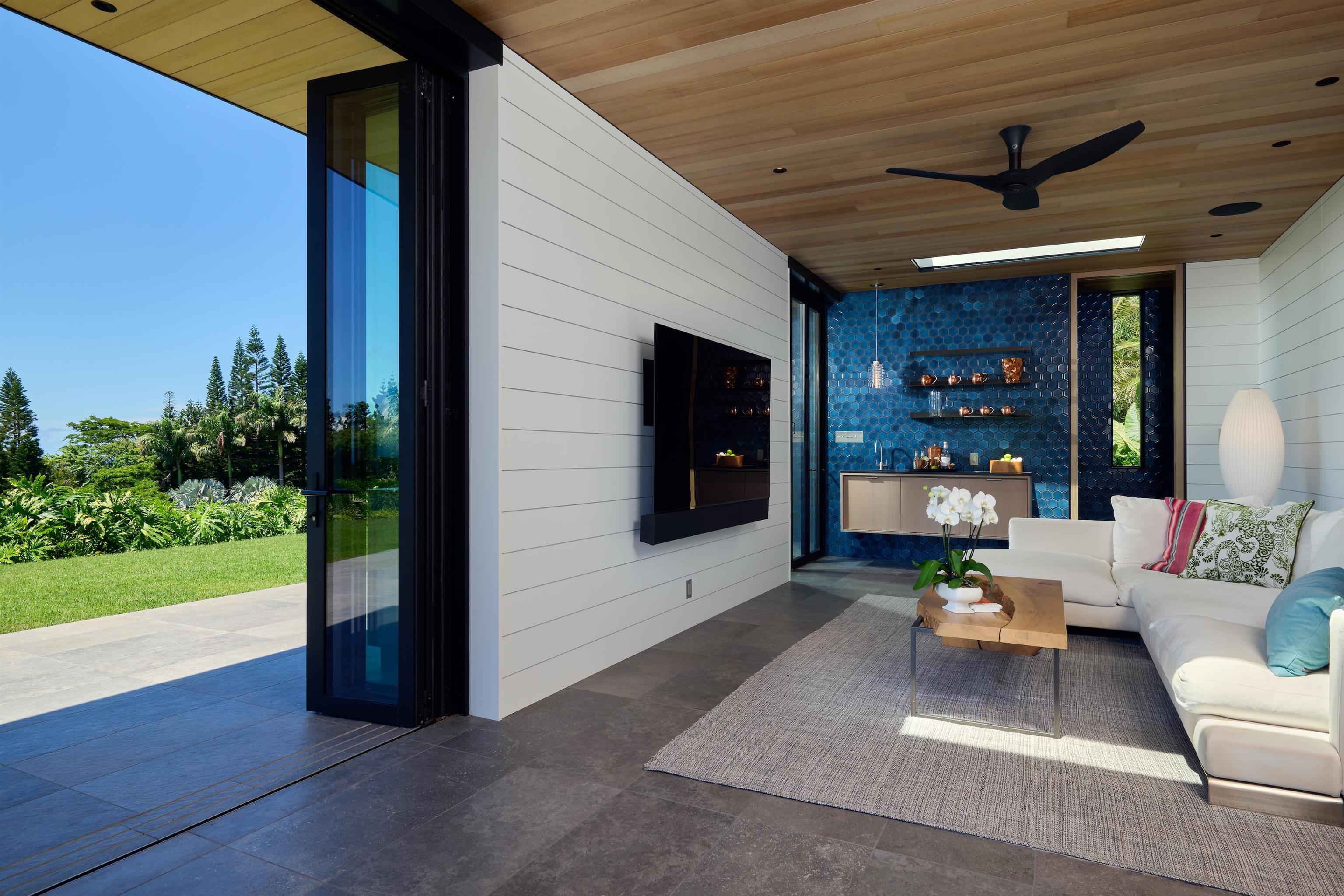 1642 West Kuiaha Road Haiku, HI 96708 - Photo 25 of 50 a living room with patio furniture and a flat screen tv
