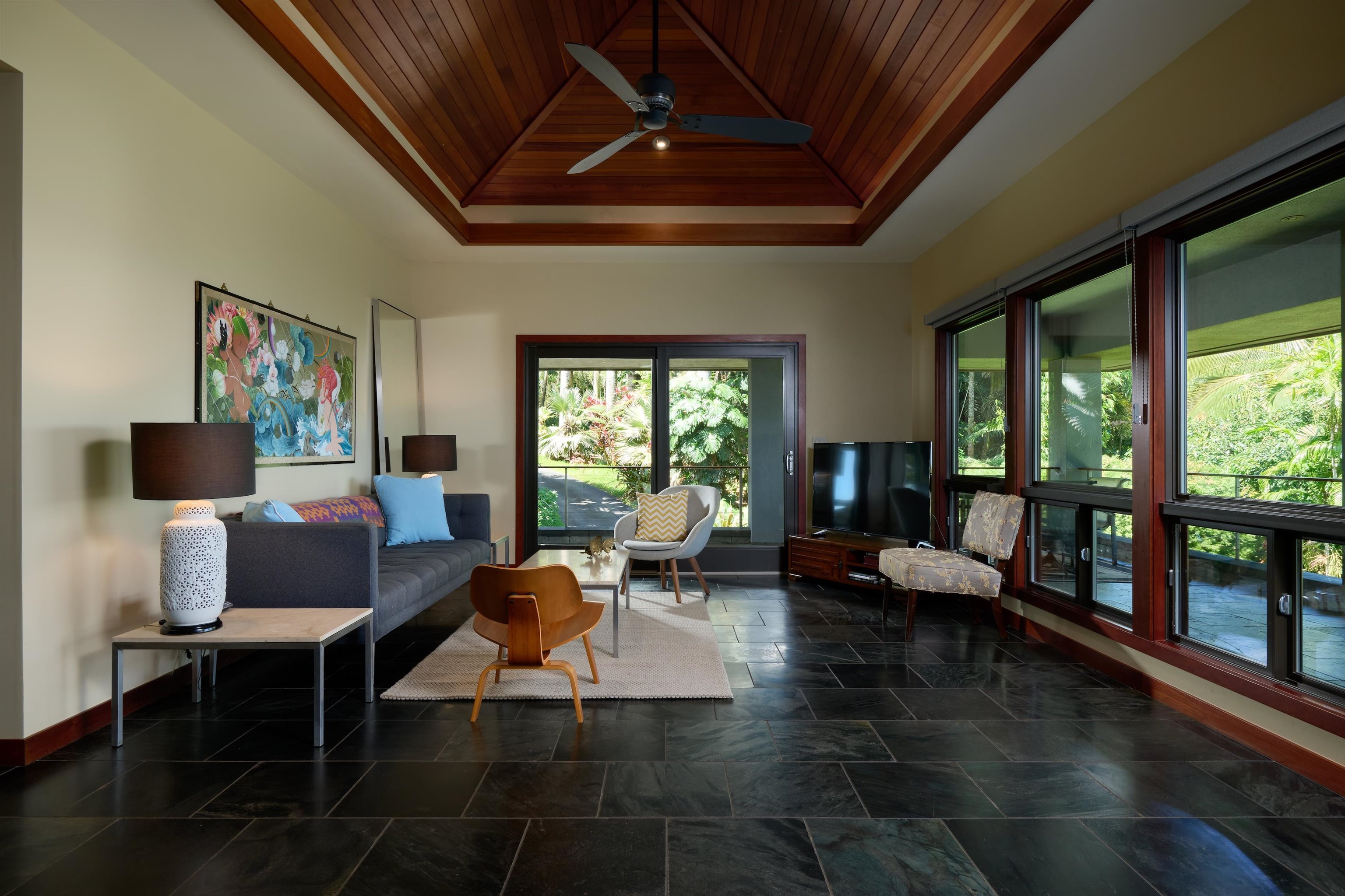 1642 West Kuiaha Road Haiku, HI 96708 - Photo 30 of 50 a living room with furniture and a flat screen tv