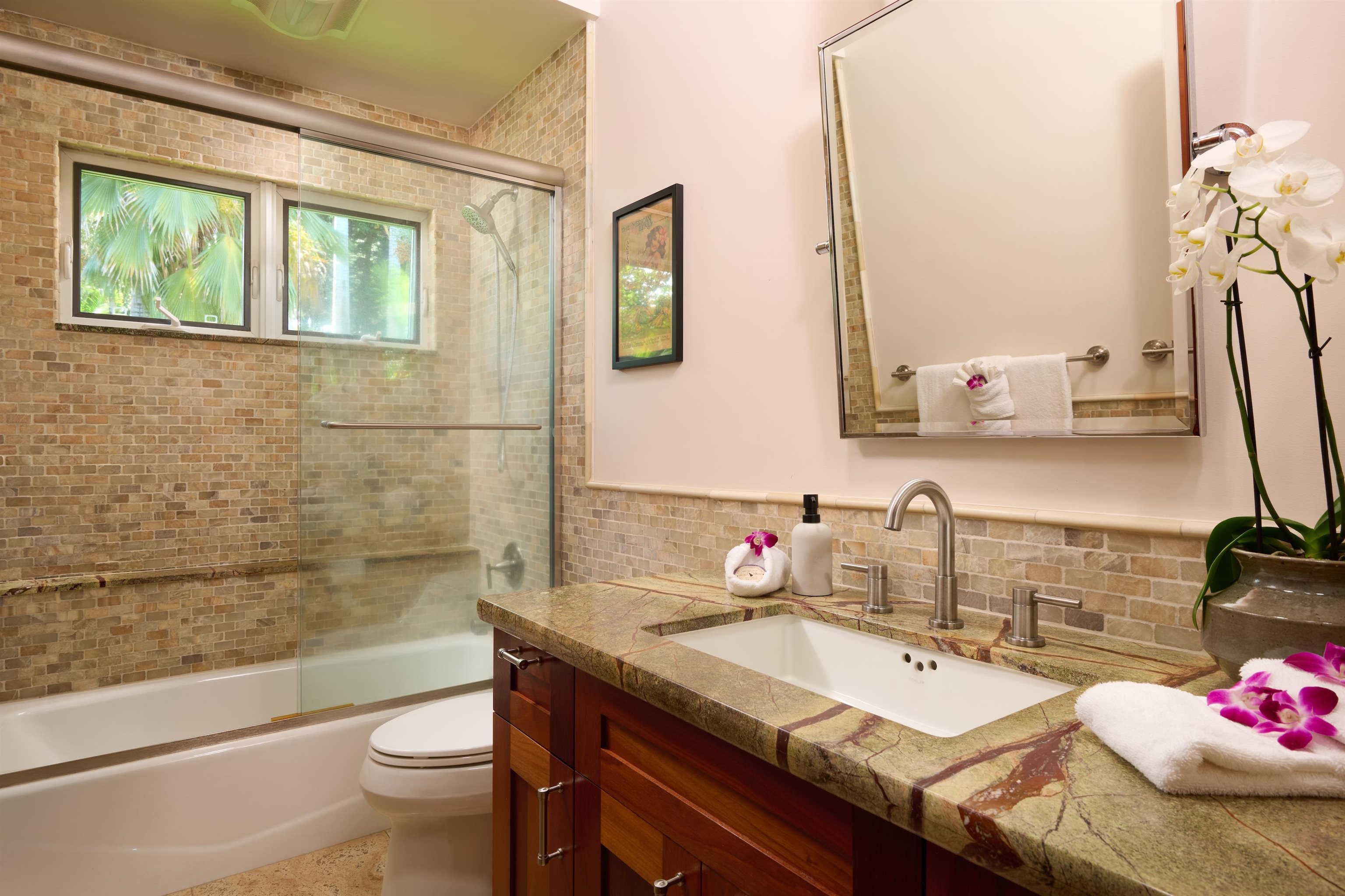 1642 West Kuiaha Road Haiku, HI 96708 - Photo 34 of 50 a bathroom with a granite countertop sink toilet and shower