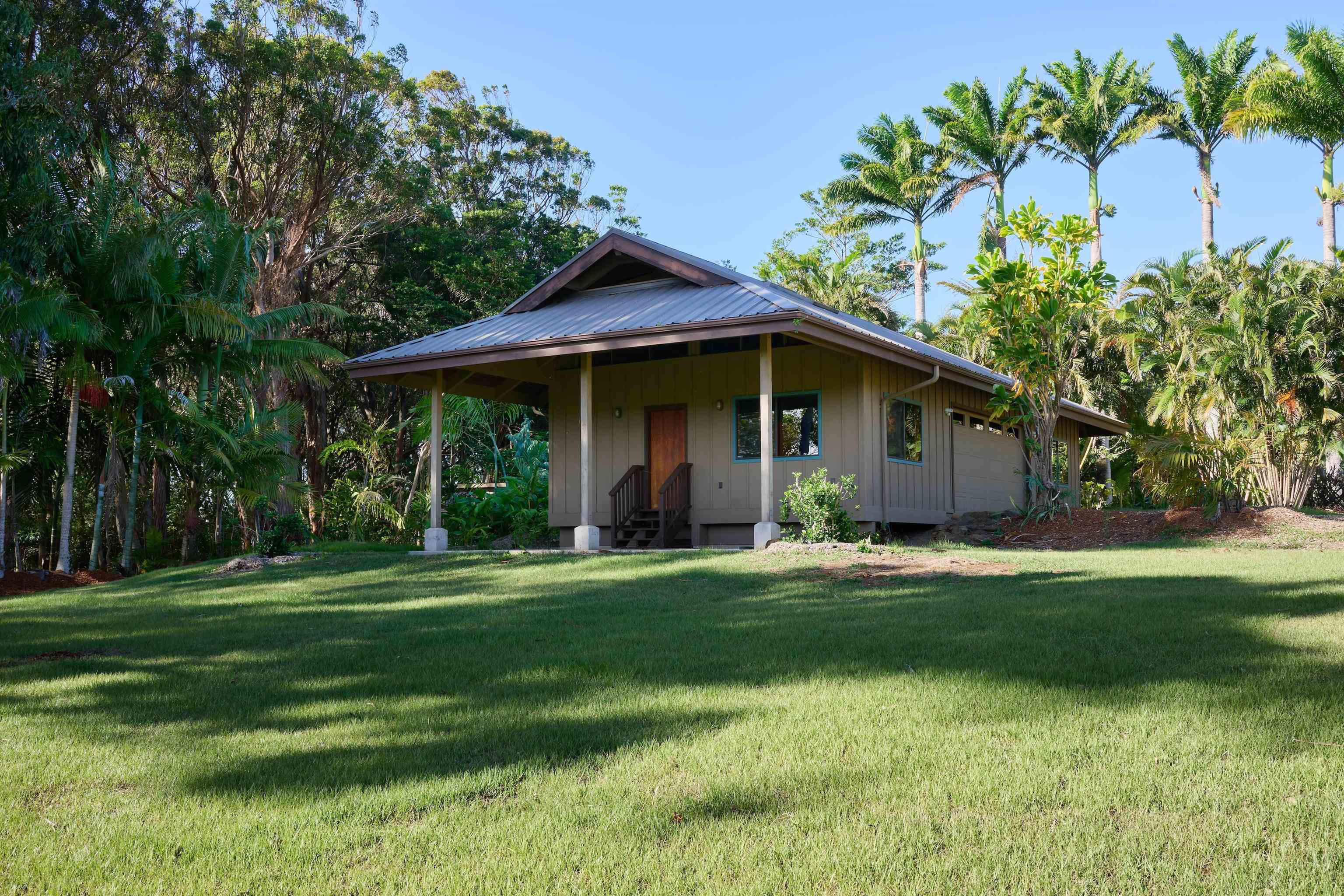 1642 West Kuiaha Road Haiku, HI 96708 - Photo 38 of 50 a view of a house with a yard