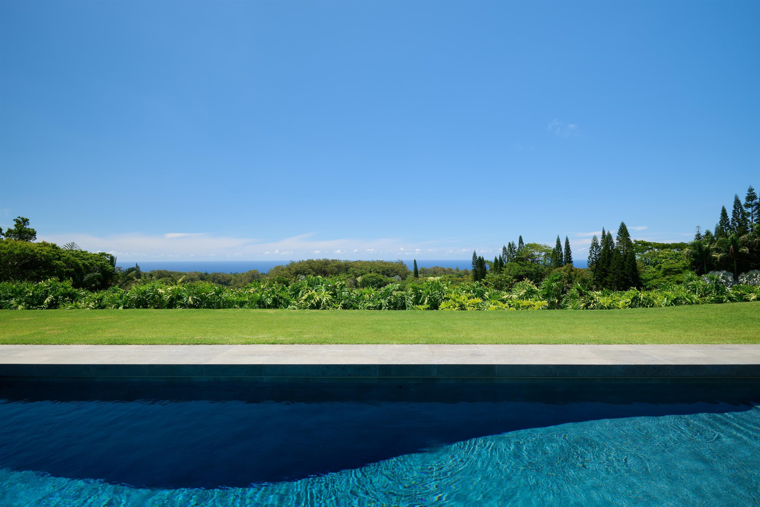 1642 West Kuiaha Road Haiku, HI 96708 - Photo 41 of 50 a view of an ocean beach and a yard