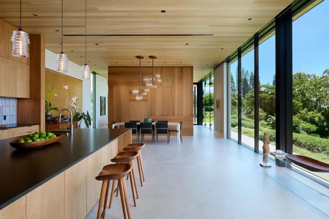 a lobby with furniture and floor to ceiling window