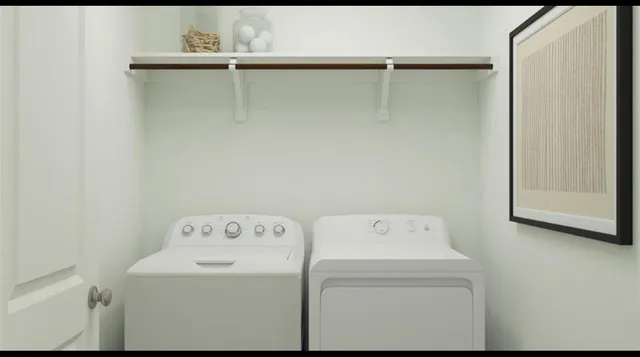 a utility room with dryer and washer